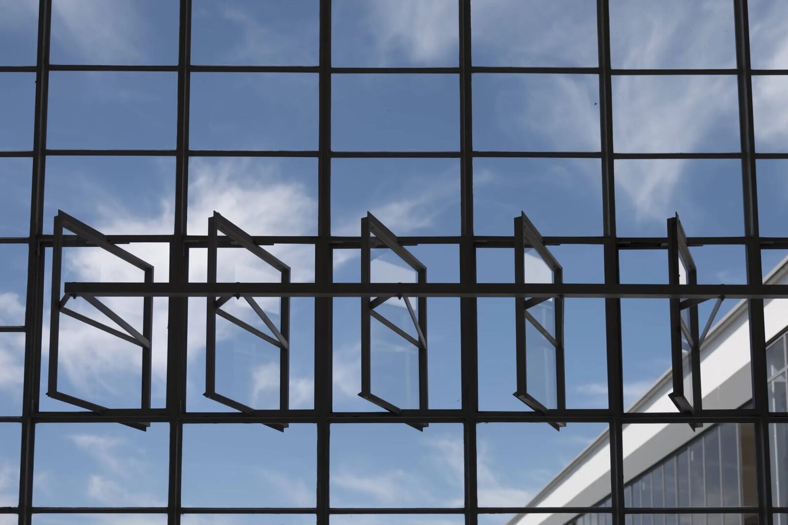 Bauhaus Museum facade with geometric steel framework against blue sky